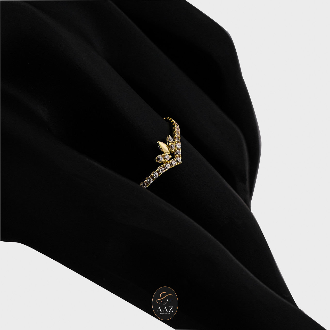 Chevron 18k Gold with Zircon Stones Ring on an index finger with a side angle