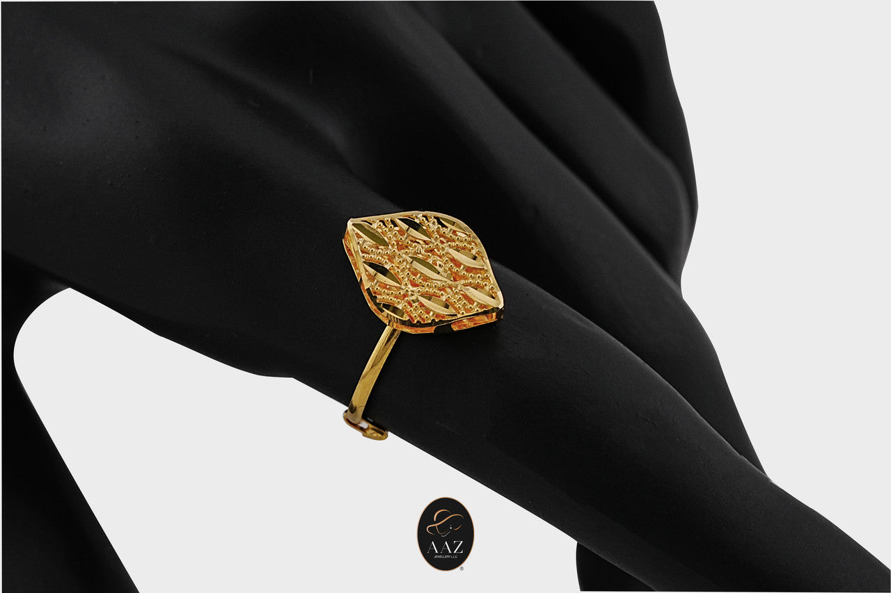 Leaf Filigree 21K Gold Ring on an index finger from a side angle