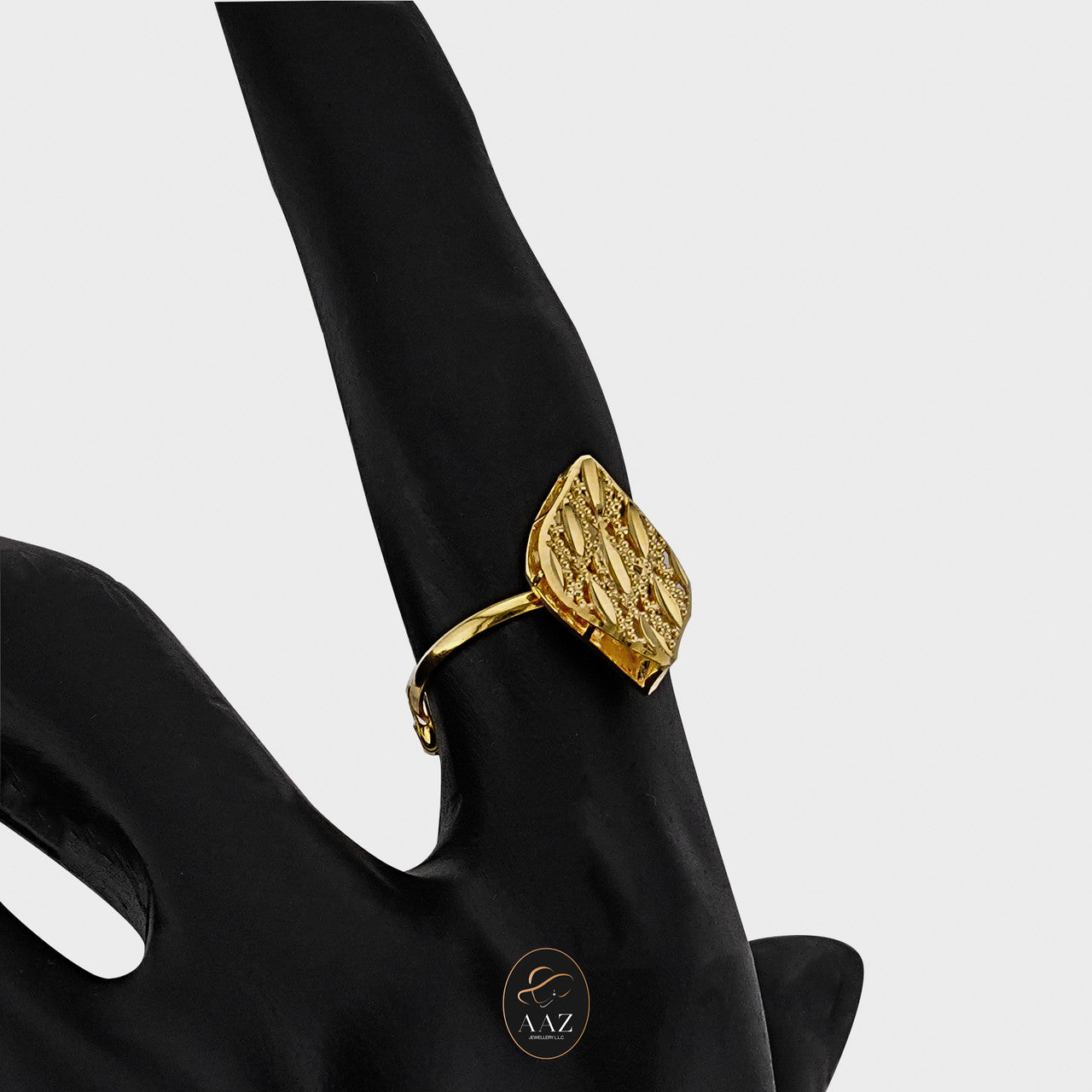 Leaf Filigree 21K Gold Ring on an index finger