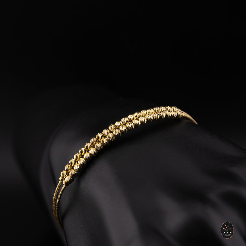 Dual Band 18k Gold Plated Silver Bangle from a side angle from a top angle
