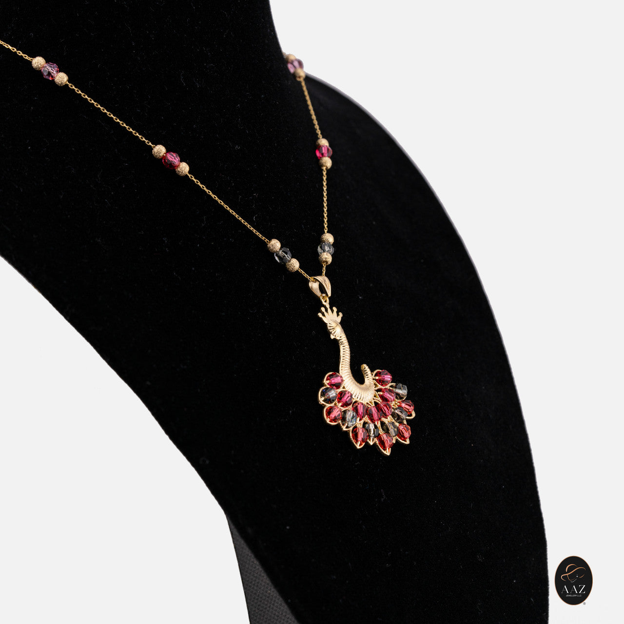 Red/Black Queen Peacock 18k Gold Plated Silver Necklace from a left angle