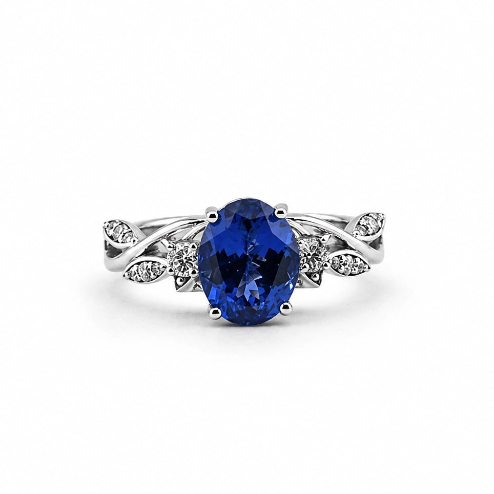Floral 18K white gold ring with oval tanzanite and lab-grown diamonds, front view